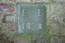Photo:The date plate in the pump house  (initials 'E.E.' as yet untraced).