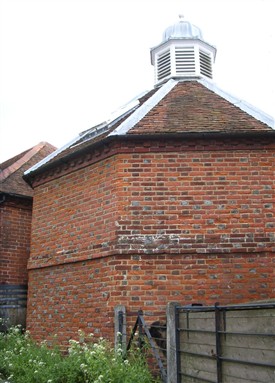 Photo:The rear of the converted dovecote showing the blackened 'burnt header' bricks