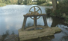 Photo:Godinton Lake (previously called Lady's Lake) with sluice-gate lifting gear. This was used to maintain the level in the lake, so giving adequate pressure to the water driving the pump wheel.